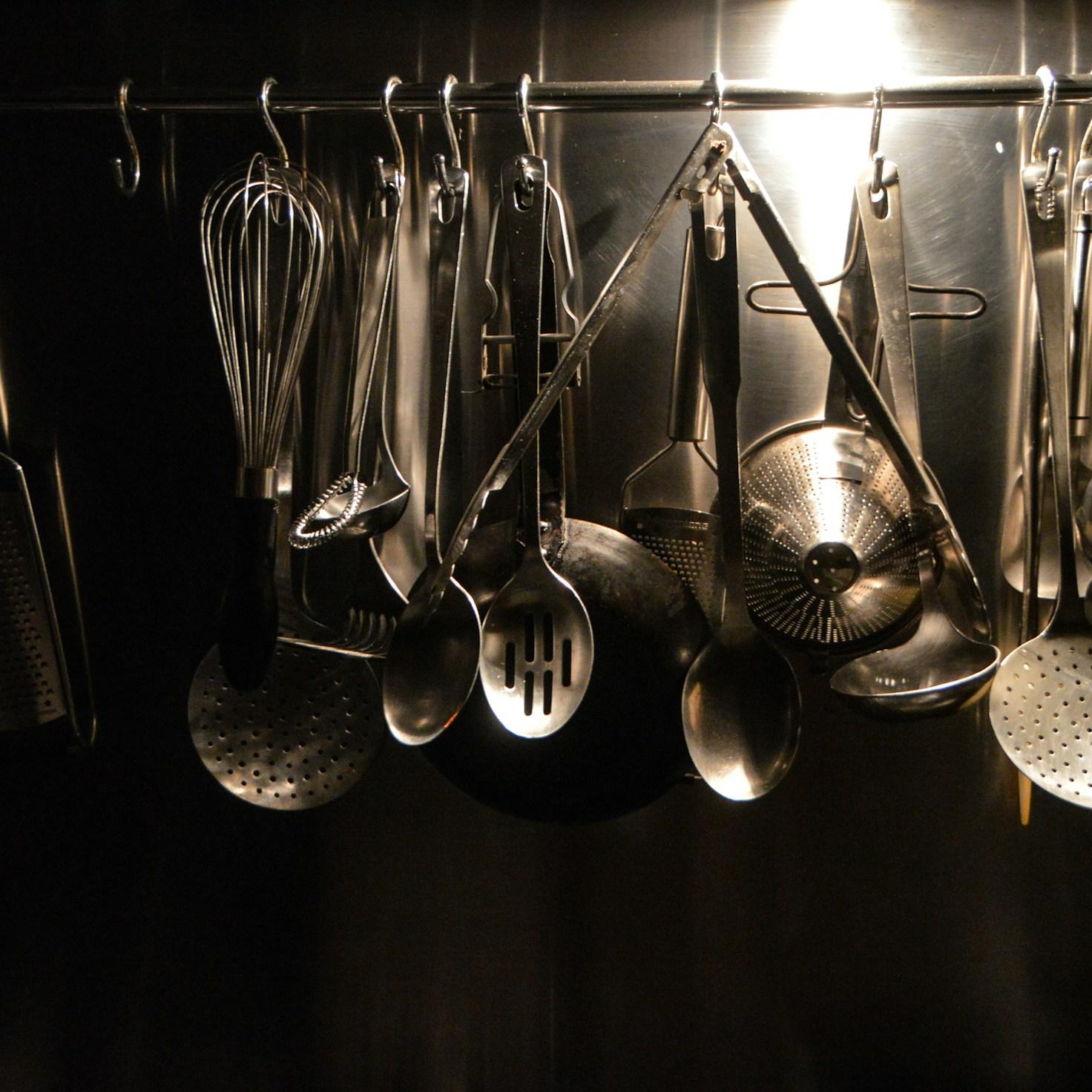 Diverse group of community members sharing a meal together, showcasing the social bonds formed through collaborative cooking